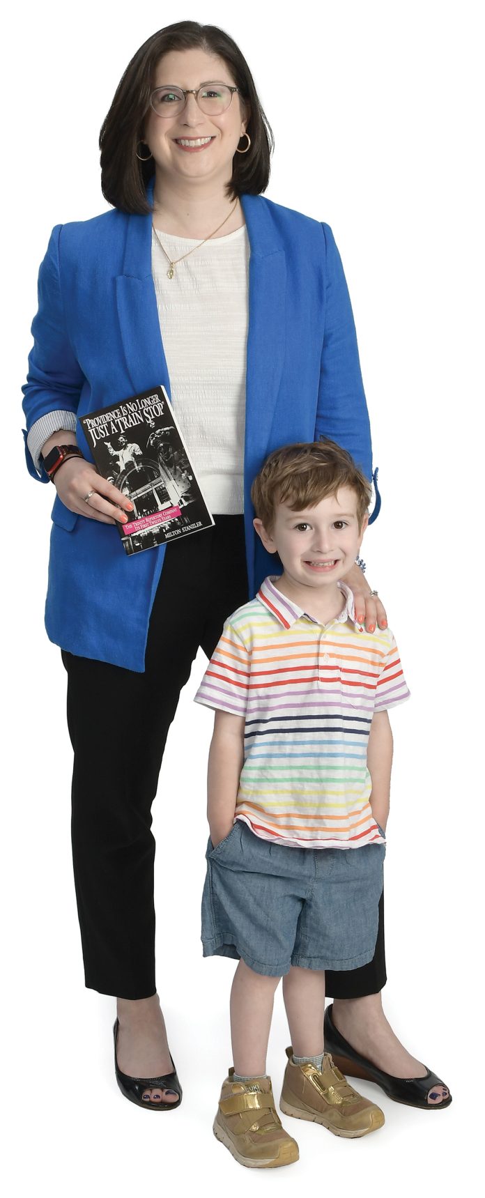the  prop  Kate Liberman poses with her son, Toby, and holds a book titled “Providence is not Just a Train Stop.”
