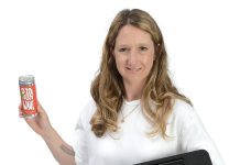 Elizabeth McDonnell the prop
Elizabeth McDonnell holds a Lightspeed point-of-sale hardware system, representing her occupation, and a case of Pizza Wine, which is
her side business she launched last month.