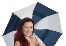 the prop  Millicent Budlong-Springer holds an umbrella and a shopping bag. “I am an eternal optimist ‘rain or shine’ and my college years at [New York University] gave me a healthy respect for what some  [New York City] retail therapy can do,” she said.