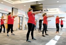 GETTING PHYSICAL: Employees at CVS Health Corp. hold a worksite workout session.  COURTESY CVS HEALTH CORP.
