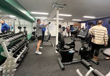 WORKING OUT: Centreville Bank employees use workout equipment at the company’s full-sized wellness center at its West Warwick headquarters.   COURTESY CENTREVILLE BANK