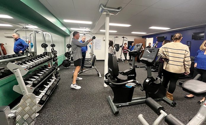 WORKING OUT: Centreville Bank employees use workout equipment at the company’s full-sized wellness center at its West Warwick headquarters.
COURTESY CENTREVILLE BANK WORKING OUT: Centreville Bank employees use workout equipment at the company’s full-sized wellness center at its West Warwick headquarters.
COURTESY CENTREVILLE BANK