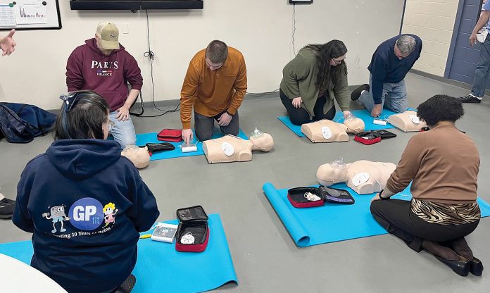 HANDS-ON LEARNING:
Groov-Pin Corp. employees take a CPR class to learn the lifesaving measure.
COURTESY GROOV-PIN CORP. HANDS-ON LEARNING:
Groov-Pin Corp. employees take a CPR class to learn the lifesaving measure.
COURTESY GROOV-PIN CORP.