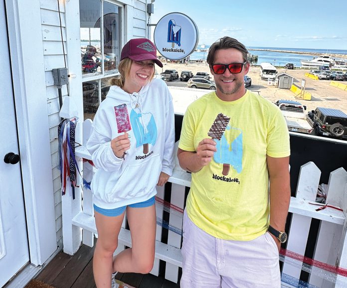 ICE POPS: Emma Andy and Bobby Welch hold some of the frozen treats available at their Blocksicle LLC ice-pop shop on Block Island. PBN PHOTO/K. CURTIS