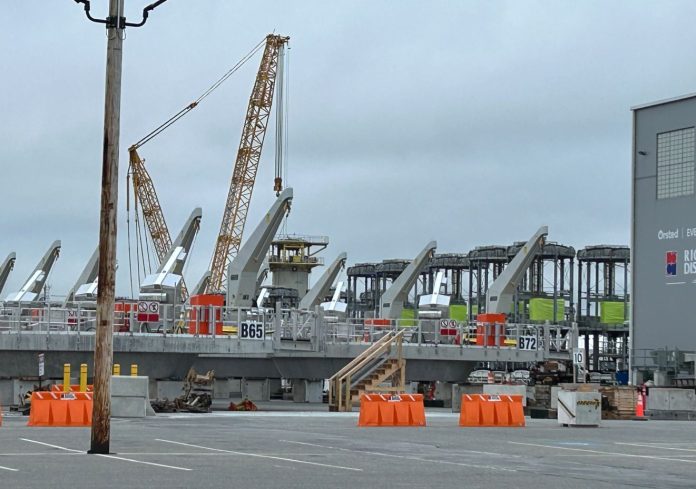 COMPONENTS FOR the Revolution Wind offshore wind farm sit ready for delivery at the port in Providence earlier this year. / PBN PHOTO/WILLIAM HAMILTON