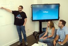 Trailblaze Marketing is using AI to blaze trails PLANNING AHEAD: Trailblaze Marketing Digital Media Manager Kyle Steinberg, left, shares ideas with co-worker Jen Guimond, center, and company founder and President Christopher Parisi.
PBN PHOTO/PAUL J. SPETRINI