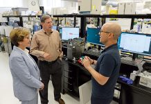R.I. Life Science Hub seeks to be a game-changer UNDERSTANDING SCIENCE: R.I. Life Science Hub Interim President Patrice M. Milos, left, and board Chairperson Neil D. Steinberg, center, talk with Barrett Bready, founder and CEO of Nabsys 2.0 LLC, in Providence.
PBN PHOTO/ELIZABETH GRAHAM