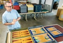 Game maker still rolling along BEAUTIFUL BOARDS: Crisloid Inc. owner Jeff Caruso shows off some of the company’s backgammon game boards.
PBN PHOTO/MICHAEL SALERNO