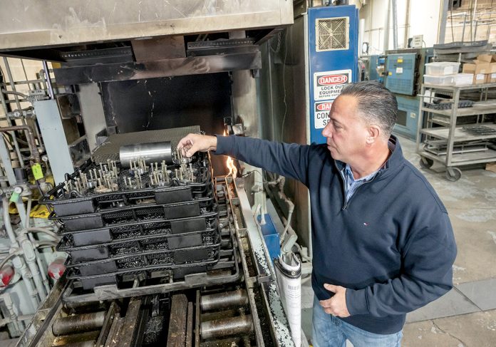 CLOSER LOOK: S&P Heat Treating Inc. Vice President Mike Rapoza examines parts at the company’s Warwick facility, which offers metal-hardening services for a variety of industries.
PBN PHOTO/MICHAEL SALERNO CLOSER LOOK: S&P Heat Treating Inc. Vice President Mike Rapoza examines parts at the company’s Warwick facility, which offers metal-hardening services for a variety of industries.
PBN PHOTO/MICHAEL SALERNO