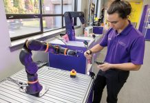 igus Bearings Inc. producing a ‘ReBeL’ with a cause STRONG ARM: Igus Bearings Inc. intern Jaden Stone programs a robotics arm that the East Providence-based company produces.
PBN PHOTO / TRACY JENKINS