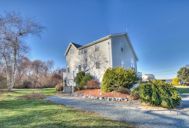 A TWO-STORY HOME at 296 West Shore Road in Portsmouth that was constructed in 1995 recently sold for $1.16 million. / COURTESY RESIDENTIAL PROPERTIES LTD.