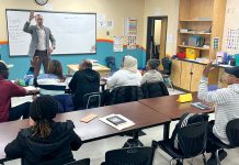 HEAD OF THE CLASS: Justin D. Bibee, Dorcas International Institute of Rhode Island’s Refugee Resettlement Department assistant director, teaches a class at the Providence nonprofit.  COURTESY DORCAS INTERNATIONAL INSTITUTE  OF RHODE ISLAND 