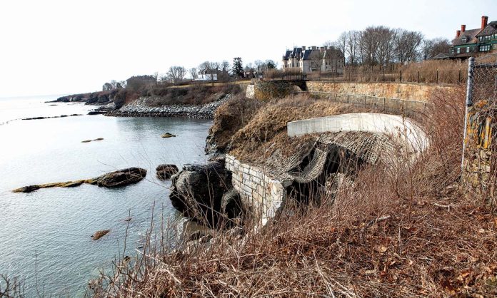 DANGER PRONE: The seawall that holds up the Cliff Walk south of Narragansett Avenue has been damaged by erosion and that section of the walk has been closed for nearly three years. A dispute over federal funding has created uncertainty about the repair.  PBN PHOTO/KATE WHITNEY LUCEY
