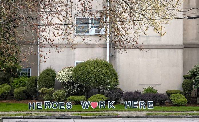 FOR SALE: A sign outside Oak Hill Center for Rehabilitation & Nursing in Pawtucket during the COVID-19 pandemic. The nursing home is one of two in Rhode Island that Pointe Group Care LLC, a for-profit company, is looking to buy. / PBN PHOTO/MICHAEL SALERNO