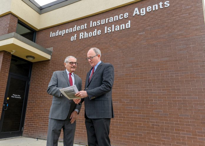 CHALLENGING MARKET: Butler & Messier Inc. insurance agent Ernie Shaghalian, left, chairman of the Government Affairs Committee of the Independent Insurance Agents of Rhode Island, meets with Mark Male, CEO and president of Rhode Island Association of Insurance Agents Inc. Shaghalian says the property insurance market is the worst he’s seen it in 45 years. PBN PHOTO/MICHAEL SALERNO