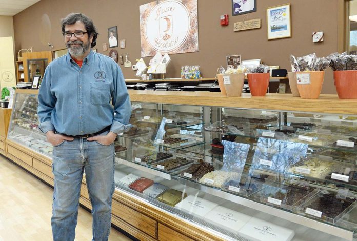 FAMILY TRADITION: Rudi Hauser Jr., owner and president of Hauser Chocolatier in Westerly, in the company’s retail shop. Hauser bought the company in 2008 from his mother and his father, Ruedi Hauser Sr., who started the company in 1985 in Connecticut after emigrating from Switzerland. PBN PHOTO/ELIZABETH GRAHAM
