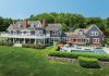 SHINING EXAMPLE: The shingle-style house known as Fowler’s Rocks in Jamestown, which includes a sweeping 6-acre yard on the east shoreline of the island, was the highest-priced house sale in Rhode Island in 2024 at $12.25 million.  COURTESY COMPASS INC.  