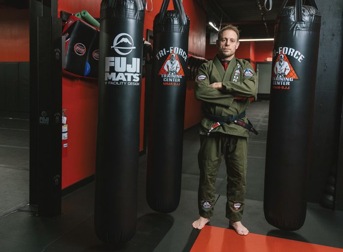 SURPRISING JOURNEY: Tri-Force MMA owner Peter Jeffrey went to school to study music and never imagined owning a mixed martial arts gym, but he started training in MMA because he “needed something physical to do” and eventually started a gym so he could train in various disciplines to be a professional fighter all in one place, then at the request of friends and fellow fighters he began holding classes and now owns the largest MMA gym in Rhode Island. PBN PHOTO/RUPERT WHITELY