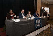 MICHELLE A. REDDISH, left, administrator for the R.I. Cannabis Commission, speaks at Providence Business News' The Business of Cannabis Summit at the Providence Marriott on Thursday. Also on the panel is, from left, Benjamin L. Rackliffe, partner of Pannone Lopes Devereaux & O’Gara LLC; Sasha Gorski, co-owner of Talaria LLC; and Ronald Crosson II, executive director of Urban Ventures Inc. and chairman and so­cial equity officer of the R.I. Cannabis Advisory Board. PBN Editor Michael Mello, standing, moderates. / PBN PHOTO/MIKE SKORSKI 