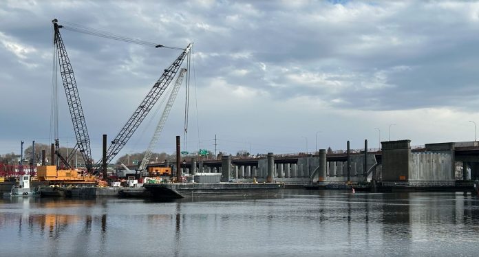 washbridgedemo OFFICIALS ARE investigating an accidental leak that dispensed hydraulic fluid into the Seekonk River just north of the Washington Bridge, according to WPRI-TV CBS 12. / PBN PHOTO/WILLIAM HAMILTON