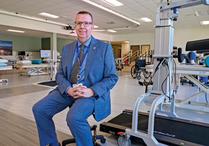 INPATIENT ­REHAB: Daniel Parkinson is the CEO of Encompass Health Rehabilitation Hospital of Johnston, a rehab facility that opened last year. PBN PHOTO/­MICHAEL SALERNO