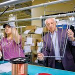 CONSTANT DIVERSIFICATION: Evelyn Gutierrez works on countertop rails for an American-made yacht with Chairman Thomas Tanury at Lincoln-based metal finishing company Tanury Industries. The company used to specialize in jewelry, but now the largest markets it serves are lighting, electronics, aerospace and giftware. PBN PHOTO/MICHAEL SALERNO