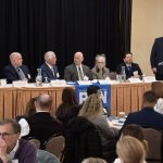 GREGORY MERCURIO, third from left, speaks during a panel discussion at Providence Business News' Health Care Summit and Health Care Heroes Awards event on Wednesday morning at the Providence Marriott. Mercurio is senior vice president of radiation oncology at American Shared Hospital Services and CEO of Precision Radiation Oncology of Rhode Island. Also on the panel is, from left, Dr. Michael Wagner, CEO and president of Care New England Health System; Joseph Trunzo, founding associate director of Bryant University's School of Health and Behavioral Sciences and a professor of psychology; Peter Marino, CEO and president of Neighborhood Health Plan of Rhode Island; Linda Hurley, CEO and president of CODAC Behavioral Healthcare; and Dr. Raj Hazarika, chief medical officer for commercial products at Point32Health. PBN Editor Michael Mello, standing, moderates. / PBN PHOTO/MIKE SKORSKI