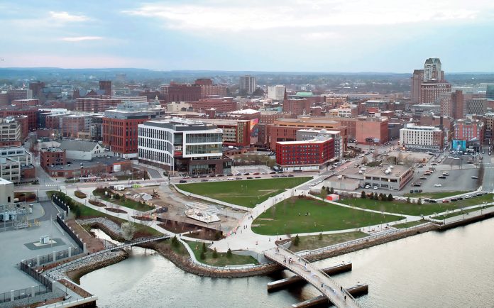 DEVELOPING SITUATION: About 7 acres of land in the I-195 Redevelopment District remain available for build-out. The 195 District Park on the west side of the Providence River, seen above, will remain open space – except for a 3,500-square-foot food and beverage pavilion under construction near the center of the park.  PBN PHOTO/ARTISTIC IMAGES