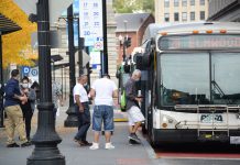 PASSENGERS GET ON a R.I. Public Transit Authority bus at Kennedy Plaza in Providence. / PBN FILE PHOTO/ELIZABETH GRAHAM