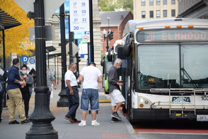 PASSENGERS GET ON a R.I. Public Transit Authority bus at Kennedy Plaza in Providence. / PBN FILE PHOTO/ELIZABETH GRAHAM