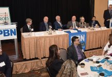 R.I. health care system needs to be more focused amid federal policy uncertainty GROUP EFFORT: Peter Marino, fourth from the left, CEO and president of Neighborhood Health Plan of Rhode Island, speaks during a panel discussion at Providence Business News’ Health Care Summit and Health Care Heroes Awards event on April 2 at the Providence Marriott. Also on the panel are, from left, Dr. Michael Wagner, CEO and president of Care New England Health System; Joseph Trunzo, founding associate director of Bryant University’s School of Health and Behavioral Sciences and a professor of psychology; Gregory Mercurio, senior vice president of radiation oncology at American Shared Hospital Services and CEO of Precision Radiation Oncology of Rhode Island; Linda Hurley, CEO and president of CODAC Behavioral Healthcare; and Dr. Raj Hazarika, chief medical officer for commercial products at Point32Health Services Inc. PBN Editor Michael Mello, standing, moderates.
PBN PHOTO/MIKE SKORSKI
