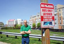 OPPOSED: Randall Rose, a member of the Kennedy Plaza Resilience Coalition, is pictured in front of one of the parcels next to the train station recommended for a new R.I. Public Transit Authority hub. PBN PHOTO/PAUL J. SPETRINI