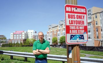OPPOSED: Randall Rose, a member of the Kennedy Plaza Resilience Coalition, is pictured in front of one of the parcels next to the train station recommended for a new R.I. Public Transit Authority hub. PBN PHOTO/PAUL J. SPETRINI