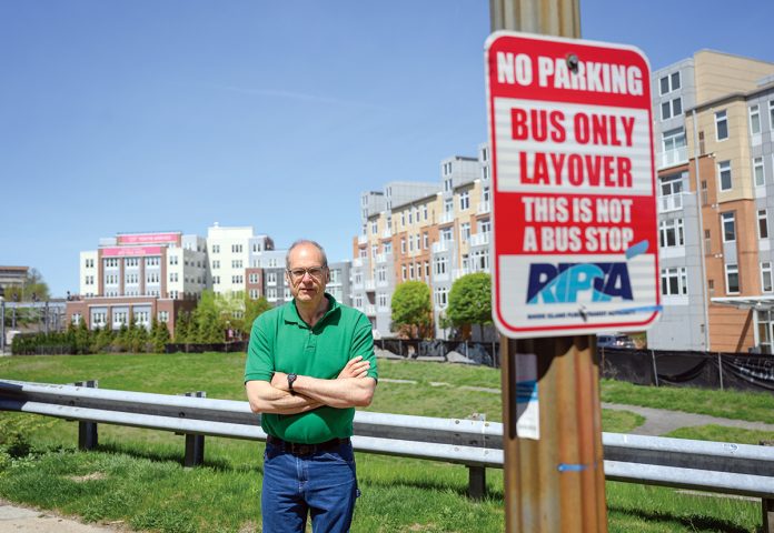 OPPOSED: Randall Rose, a member of the Kennedy Plaza Resilience Coalition, is pictured in front of one of the parcels next to the train station recommended for a new R.I. Public Transit Authority hub. PBN PHOTO/PAUL J. SPETRINI