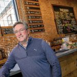 DRINKING UP: Jeremy Duffy, co-founder of Isle Brewers Guild LLC, thinks the Pawtucket-Central Falls Transit Center has helped his business, though others say the station has not noticeably boosted foot traffic along nearby Main Street.  PBN FILE PHOTO/­MICHAEL SALERNO