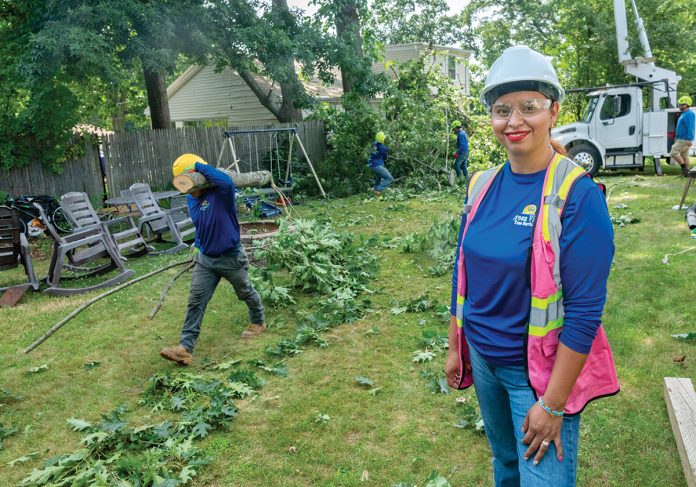 TAKING ROOT: Gloria Chacón, a licensed arborist and owner of Green View Tree Service LLC, with her crew at a worksite in North Providence.  PBN FILE PHOTO/MICHAEL SALERNO