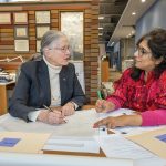 PLAN ­REVIEW: ­Barbara Thornton, left, a partner at Brewster Thornton Group Architects LLP, and Aarti Kathuria, one of the firm’s project managers, go over plans for a project.  PBN FILE PHOTO/­MICHAEL SALERNO