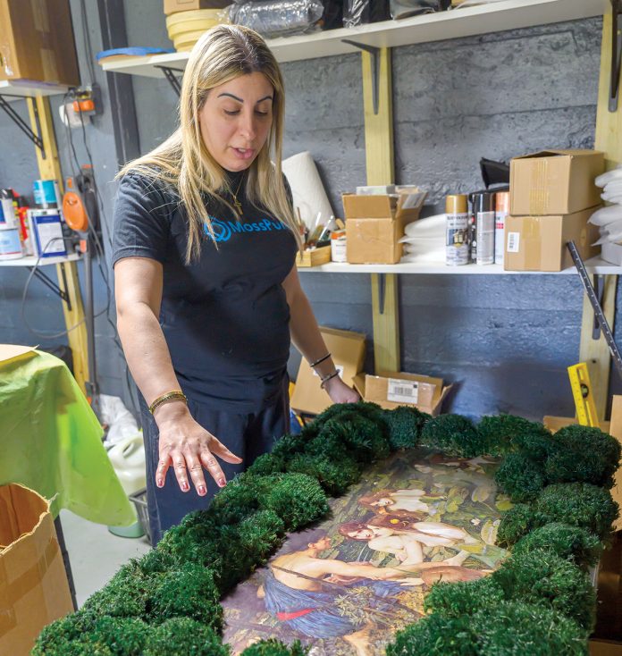 DOUBLE DUTY: Jamie Mitri, founder and owner of Moss Pure in Cumberland, is aiming to ­transform the green art sector, offering a product that serves as both a contemporary art piece and an innovation in air filtering and purification without the need for electricity, sunlight or water. PBN PHOTO/MICHAEL SALERNO
