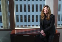 OPENING DOORS: Among her roles at Webster Bank N.A., Kimberly Peckham serves as a mentor through the bank’s credit rotational program to introduce young bankers to a variety of financial opportunities.  PBN PHOTO/PAUL J. SPETRINI