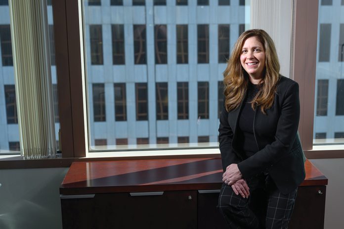OPENING DOORS: Among her roles at Webster Bank N.A., Kimberly Peckham serves as a mentor through the bank’s credit rotational program to introduce young bankers to a variety of financial opportunities.  PBN PHOTO/PAUL J. SPETRINI