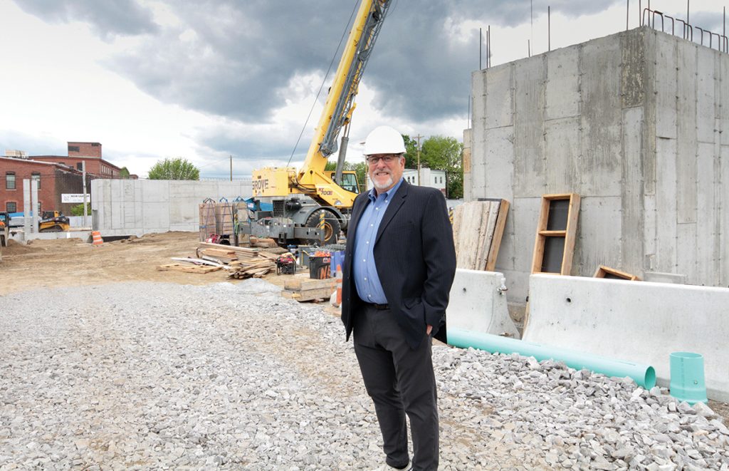 NEW GROUND: Developer Leland Peyser at the site of Dexter Street Commons, a $55 million, 150-unit apartment complex under construction near the train stop.
PBN PHOTO/ARTISTIC IMAGES