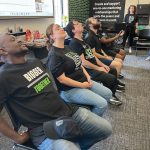 Workplace wellness critical to Big Brothers Big Sisters’ mission TASTE TEST: Big Brothers Big Sisters of Rhode Island try to eat cookies from their own foreheads during a contest at the nonprofit’s office.
COURTESY BIG BROTHERS BIG SISTERS OF RHODE ISLAND