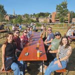 GARDEN PARTY: Building Enclosure Science LLC employees enjoy some drinks at a local beer garden.  COURTESY BUILDING ENCLOSURE SCIENCE LLC