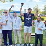GOING FOR GOLD: Centreville Bank staffers participate in the company’s 2024 Olympic-themed block party. Winners take to the award podium to cheer and accept their medals.   COURTESY CENTREVILLE BANK