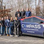 KEEP ON TRUCKING: Members of the Compass IT Compliance LLC team gather at the company’s North Providence headquarters with the company Tesla Cybertruck.  COURTESY COMPASS IT COMPLIANCE LLC
