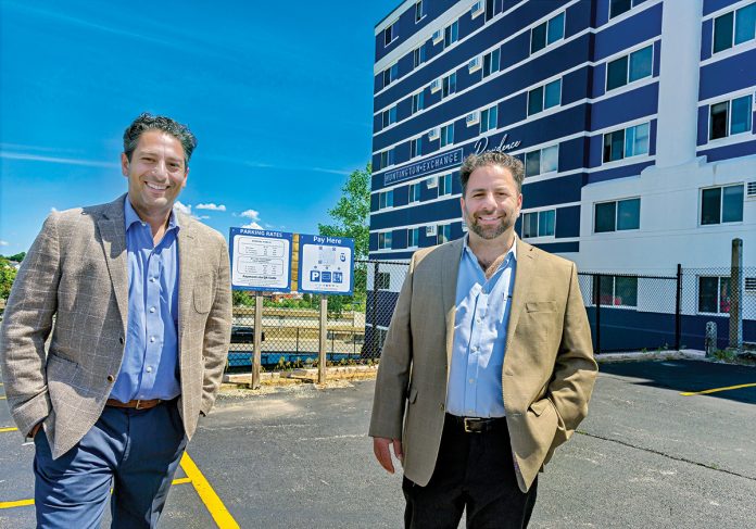 DYNAMIC DUO: Kenneth Zorabedian, left, is the owner and his brother, Robert Zorabedian, is the director of United Parking LLC, a Providence-based valet and parking management company that just took over the Mt. Fuji/ Huntington Exchange parking lot in Providence. The brothers recently celebrated 20 years in business. PBN PHOTO/MICHAEL SALERNO