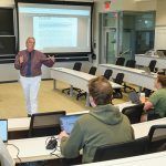 A BIT EMPTY: Charles Cullinan, Bryant University Accounting Department chair and professor, teaches a class at Bryant in Smithfield. He acknowledges that there are fewer students aspiring to become accountants these days.  PBN PHOTO/MICHAEL SALERNO