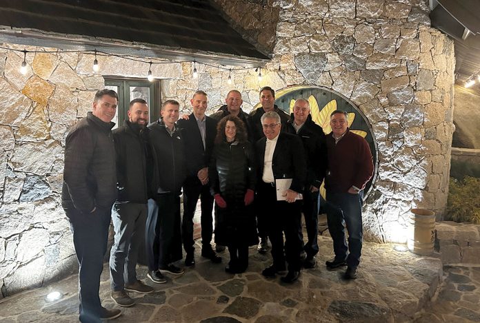 HOUSE PARTY: Edward D. Jones & Co. LP Rhode Island associates meet at Hobbit House in Richmond.  COURTESY EDWARD D. JONES & CO. LP