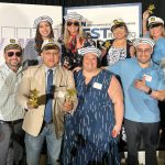 Falvey Insurance Group SAILING AWAY: Falvey Insurance Group staffers wear sailors hats while celebrating at Providence Business News’ Best Places to Work event last year.
COURTESY FALVEY INSURANCE GROUP