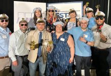 SAILING AWAY: Falvey Insurance Group staffers wear sailors hats while celebrating at Providence Business News’ Best Places to Work event last year.  COURTESY FALVEY INSURANCE GROUP